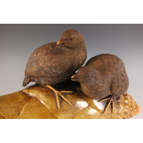 347 - A large Japanese porcelain model of two quail on a bamboo root, 19th century, each bird modelled per... 
