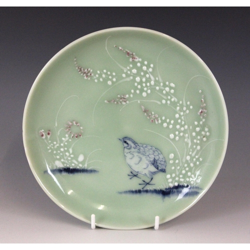 348 - A Chinese celadon-ground famille rose dish, 19th century, of circular form and panted to the centre ... 