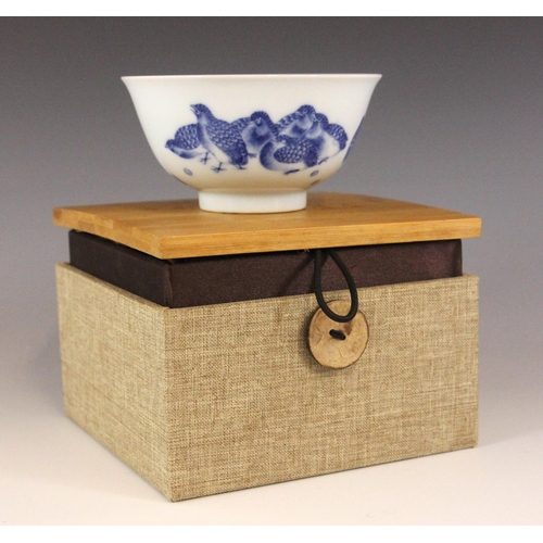 350 - A Chinese porcelain blue and white 'Quail' tea bowl, Yongzheng seal mark, the tapered cylindrical bo... 
