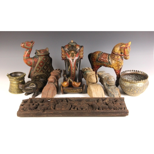 320 - A collection of Indian and South East Asian carvings, 20th century, to include an elephant, a horse,... 