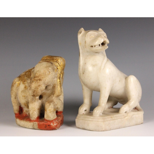 322 - A carved marble and gilt painted model of a mythical beast, India, 19th century, modelled seated on ... 