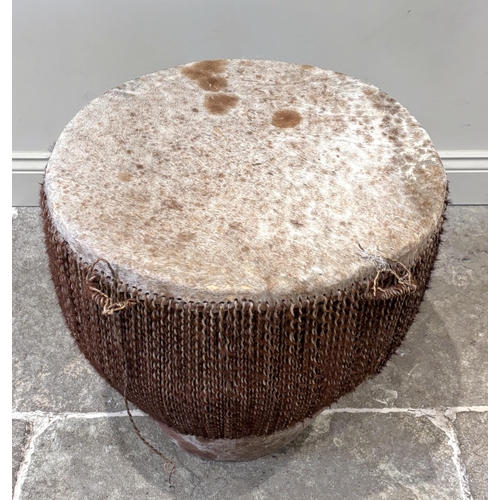 388 - An East African tribal, floor standing drum, covered in cow hide, 58cm H