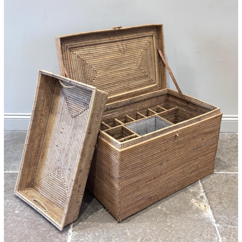 596 - An Anglo-Indian wicker campaign picnic hamper, circa 1910, of rectangular form, the hinged lid openi... 