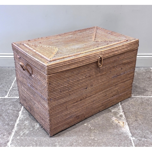 596 - An Anglo-Indian wicker campaign picnic hamper, circa 1910, of rectangular form, the hinged lid openi... 