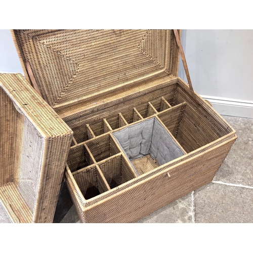596 - An Anglo-Indian wicker campaign picnic hamper, circa 1910, of rectangular form, the hinged lid openi... 