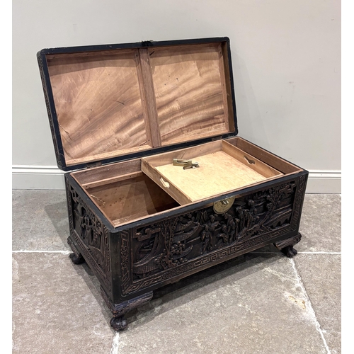 597 - An early 20th century Chinese carved hardwood blanket chest, the rectangular chest carved in high re... 
