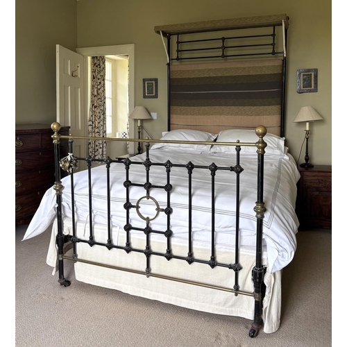 567 - A Victorian cast iron and lacquered brass half tester, double bed, the black painted frame with spin... 
