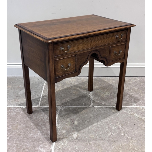 583 - A George III style oak and mahogany crossbanded lowboy, with single frieze drawer above two smaller ... 