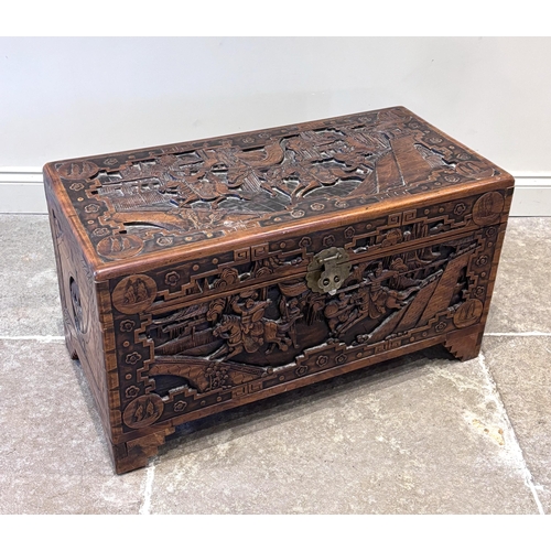 590 - An early 20th century Chinese carved hardwood blanket box, of rectangular form, carved in relief to ... 