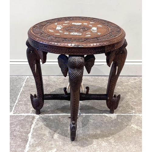 591 - An Anglo-Indian carved hardwood and ivory inlaid occasional table, early 20th century, the circular ... 