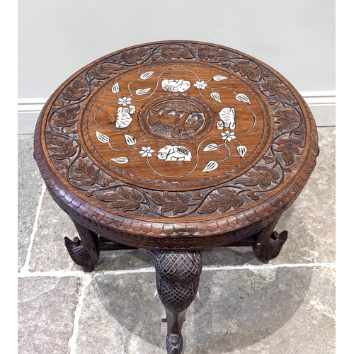 591 - An Anglo-Indian carved hardwood and ivory inlaid occasional table, early 20th century, the circular ... 