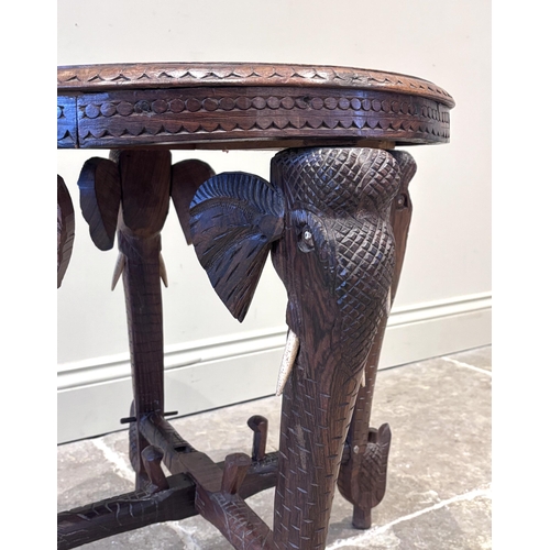 591 - An Anglo-Indian carved hardwood and ivory inlaid occasional table, early 20th century, the circular ... 