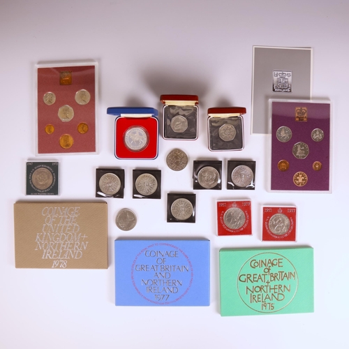 79 - A collection of coins, including commemorative coins and sets, some silver, including Silver Wedding... 
