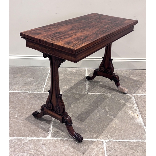 552 - A William IV rosewood 'Seddon Action' card table, the fold-over top lined with claret baize, upon a ... 