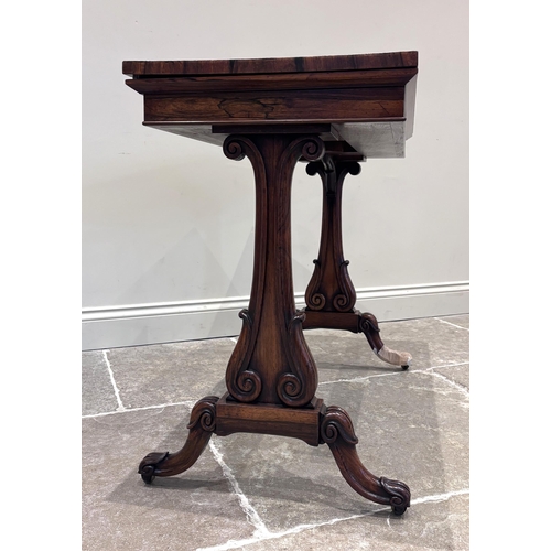 552 - A William IV rosewood 'Seddon Action' card table, the fold-over top lined with claret baize, upon a ... 