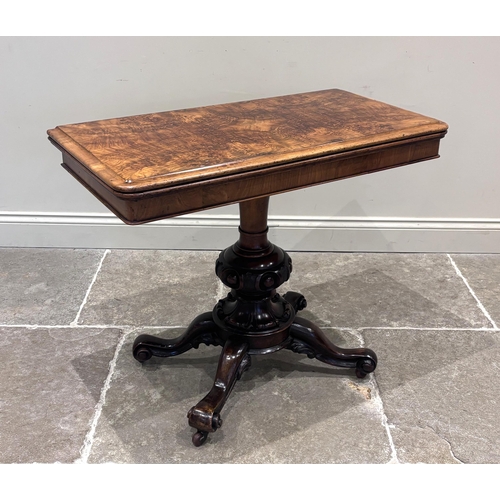 558 - A Victorian burr walnut card table, the rounded rectangular top opening to reveal a baize lined inte... 