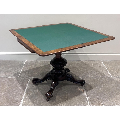 558 - A Victorian burr walnut card table, the rounded rectangular top opening to reveal a baize lined inte... 