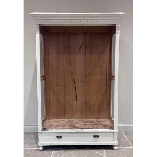 562 - A French painted pine glazed display cabinet, the pair of glazed doors enclosing three shelves, the ... 