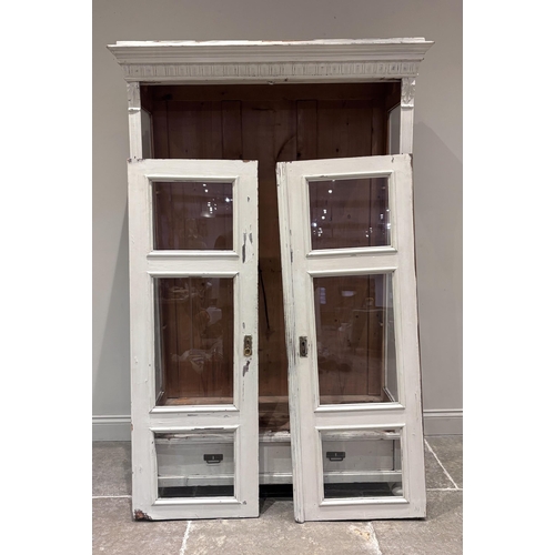 562 - A French painted pine glazed display cabinet, the pair of glazed doors enclosing three shelves, the ... 