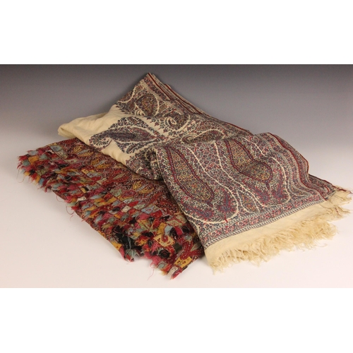398 - A 19th century finely woven Kashmir style paisley shawl, in ivory with a paisley pattern border, fri... 