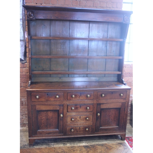 551A - A George III oak dresser, probably Conwy Valley, the moulded cornice above a plain frieze applied wi... 