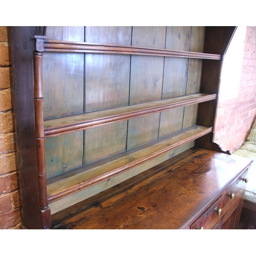 551A - A George III oak dresser, probably Conwy Valley, the moulded cornice above a plain frieze applied wi... 
