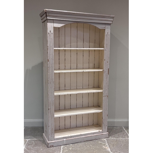 566 - A painted pine free-standing open bookcase, late 19th century, of architectural form with four fixed... 