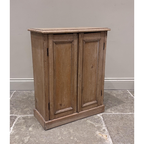 568 - A pine spice cupboard, 19th century, formed as a pair of paneled doors enclosing two removeable shel... 