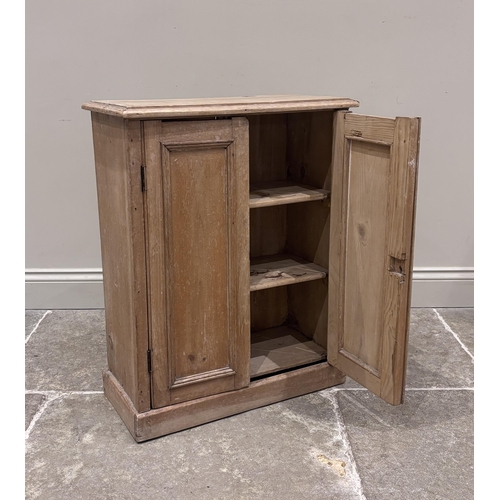 568 - A pine spice cupboard, 19th century, formed as a pair of paneled doors enclosing two removeable shel... 