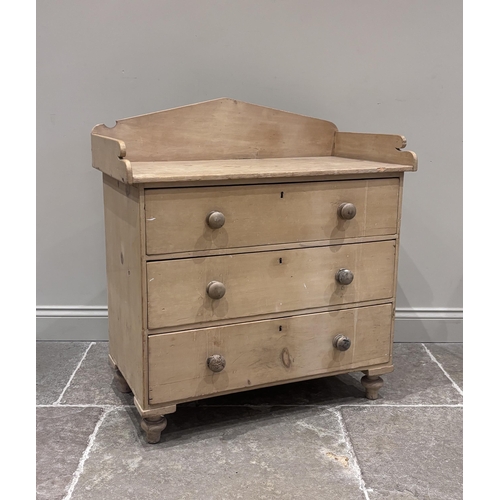 569 - A pine chest of drawers, late 19th century, the rectangular three-quarter galleried top above three ... 