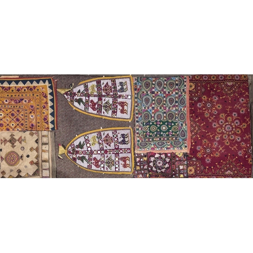 A collection of textiles to include; a Paisley pattern woven panel, an ...