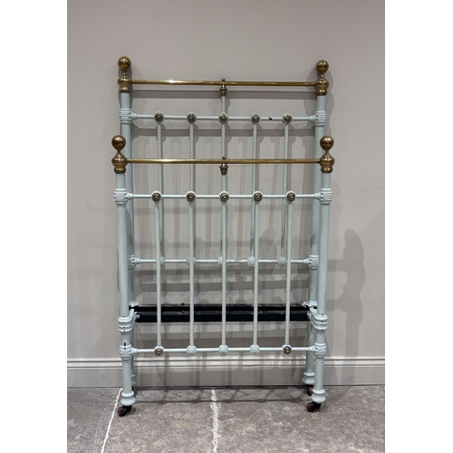 579 - A Victorian cast iron and lacquered brass single bed frame, later green painted and raised on castor... 