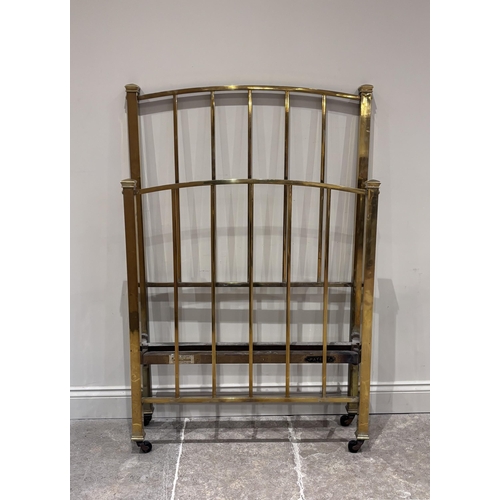 579 - A Victorian cast iron and lacquered brass single bed frame, later green painted and raised on castor... 