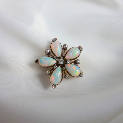 127 - A 19th century opal and diamond brooch/pendant, the five pear shaped cabochon opals set with old cut... 