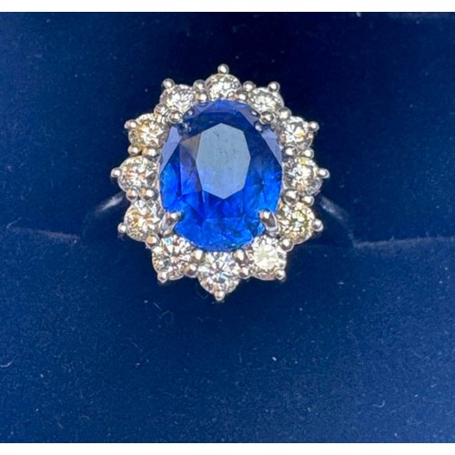 135 - A mid 20th century certified sapphire and diamond cluster ring, circa 1960, the oval sapphire within... 