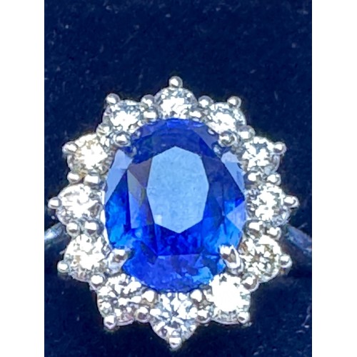 135 - A mid 20th century certified sapphire and diamond cluster ring, circa 1960, the oval sapphire within... 