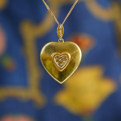 120 - A mid 20th century diamond heart pendant, the pendant set with forty six graduated round cut diamond... 