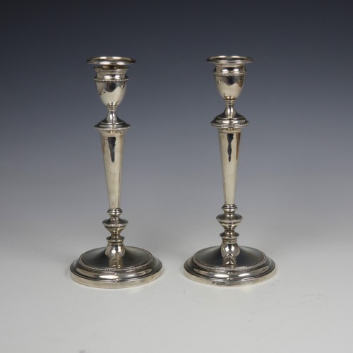 48 - A near matched pair of George V silver candelabra, Sibray Hall & Co Ltd, London 1910/1913, the groov... 