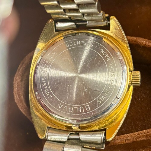 82 - A mid 20th century Bulova Accutron wristwatch, the circular gold coloured dial with Arabic numerals ... 