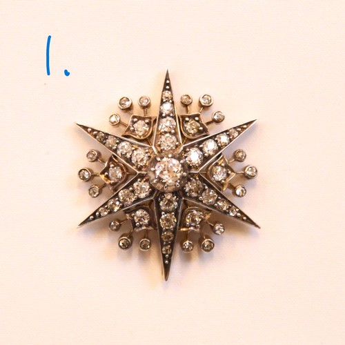 150 - A 19th century trio of diamond brooches converting to a tiara, hair combs and /or pendants, the thre... 