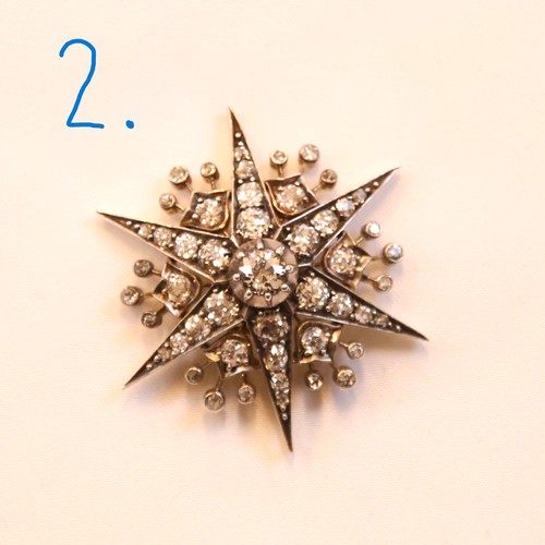 150 - A 19th century trio of diamond brooches converting to a tiara, hair combs and /or pendants, the thre... 