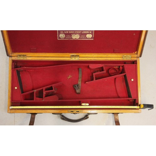 395 - A shotgun case by Joseph Lang and Son, early 20th century, the wooden framed leather and brass bound... 