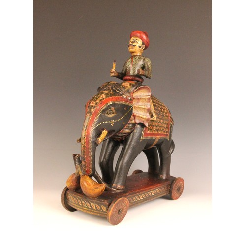 320 - A collection of Indian and South East Asian carvings, 20th century, to include an elephant, a horse,... 