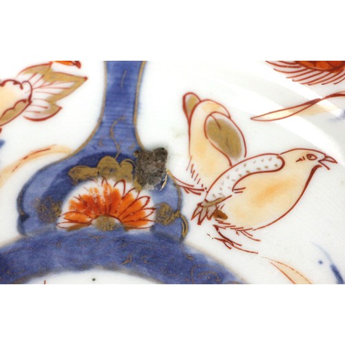 343 - A set of four Japanese Imari porcelain plates, Arita, 18th century, each of circular form and decora... 