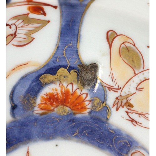 343 - A set of four Japanese Imari porcelain plates, Arita, 18th century, each of circular form and decora... 