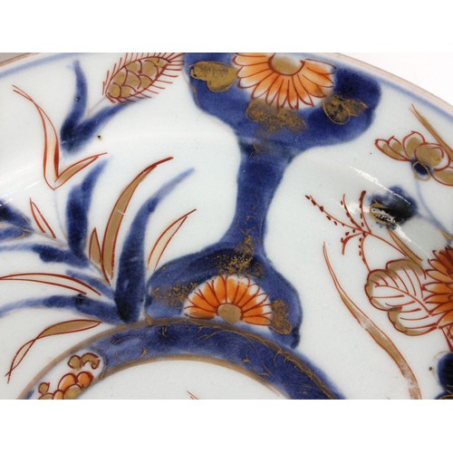 343 - A set of four Japanese Imari porcelain plates, Arita, 18th century, each of circular form and decora... 
