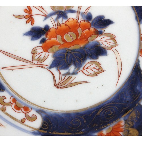 343 - A set of four Japanese Imari porcelain plates, Arita, 18th century, each of circular form and decora... 