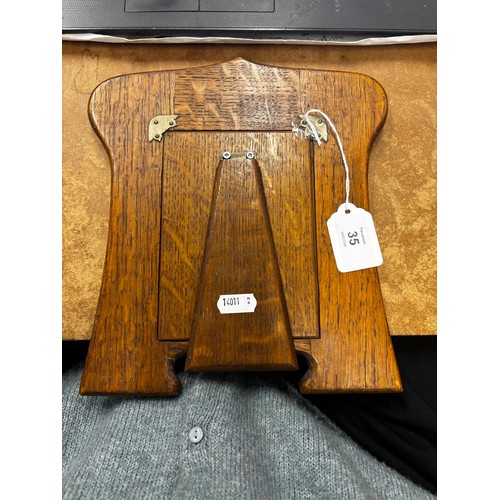 35 - An Edwardian silver mounted photograph frame, Charles S Green & Co Ltd, Birmingham 1904, the Arts an... 