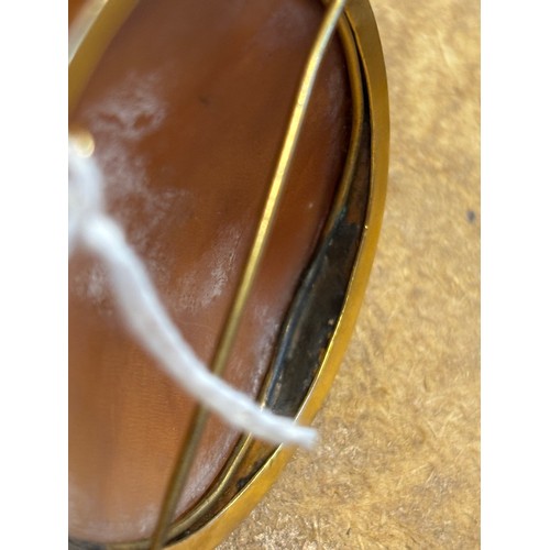 115 - A 19th century Italian cameo brooch, the central oval depiction of the Madonna with child, within a ... 