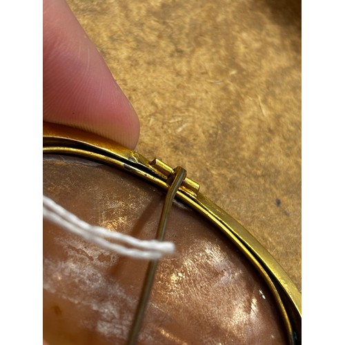 115 - A 19th century Italian cameo brooch, the central oval depiction of the Madonna with child, within a ... 